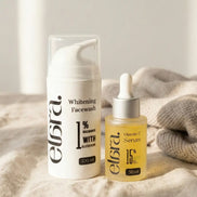 Elara whitening facewash and vitamin C serum on a textured surface with a neutral background
