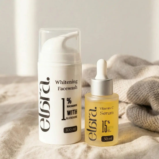 Elara whitening facewash and vitamin C serum on a textured surface with a neutral background