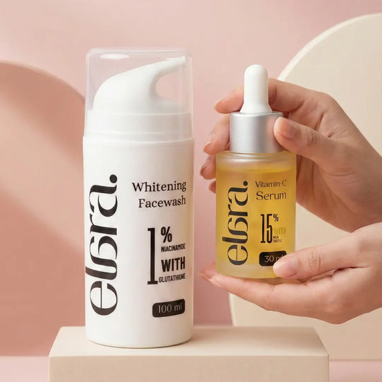 Elera Whitening Facewash and Vitamin C Serum on a pink background