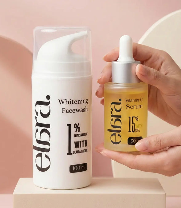 Elera Whitening Facewash and Vitamin C Serum on a pink background