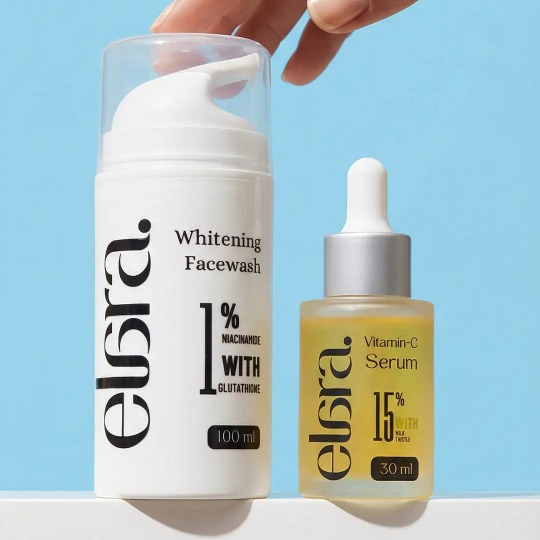 Elara Whitening Facewash and Vitamin-C Serum bottles on a light blue background