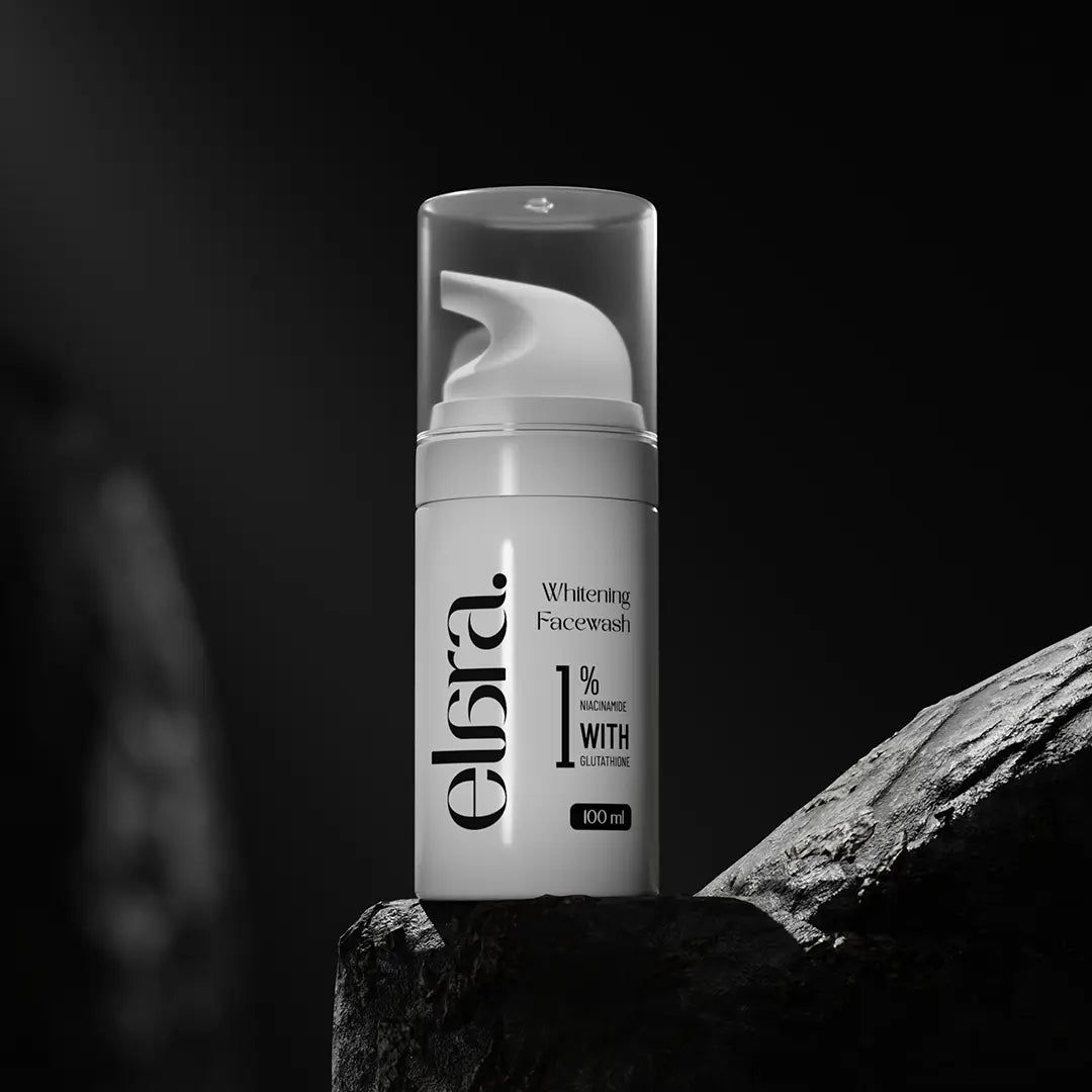 Elara whitening facewash bottle on a dark background