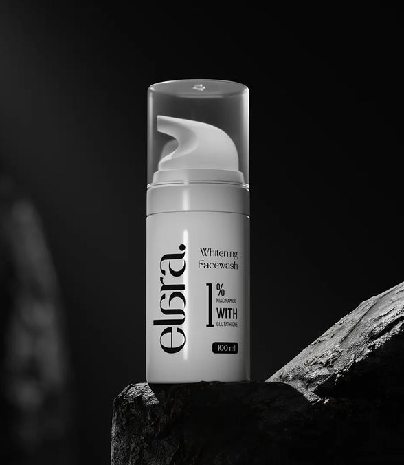 Elara whitening facewash bottle on a dark background